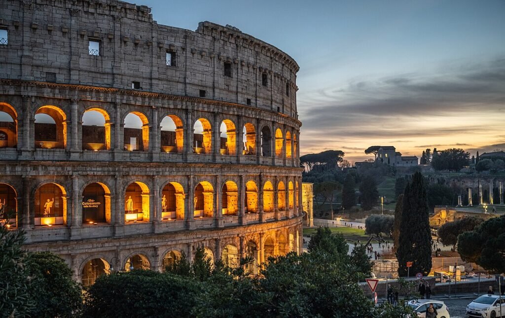 The Colosseum in Rome with its arches illuminated